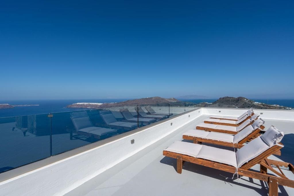 Sunbeds on the terrace above the sea