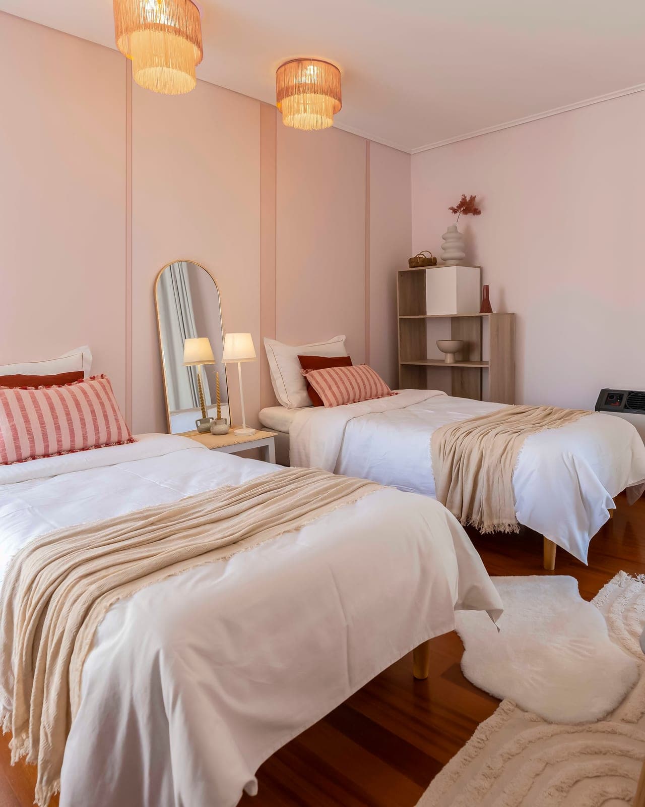 Twin beds with striped linen